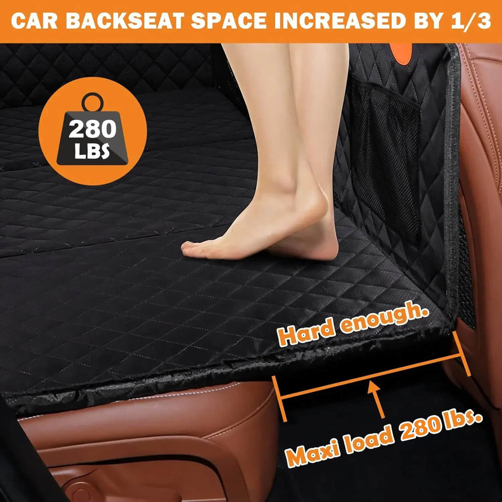 RuffRover 2.0 hard bottom dog car seat protector with increased backseat space, showing a foot on the edge and load capaci...