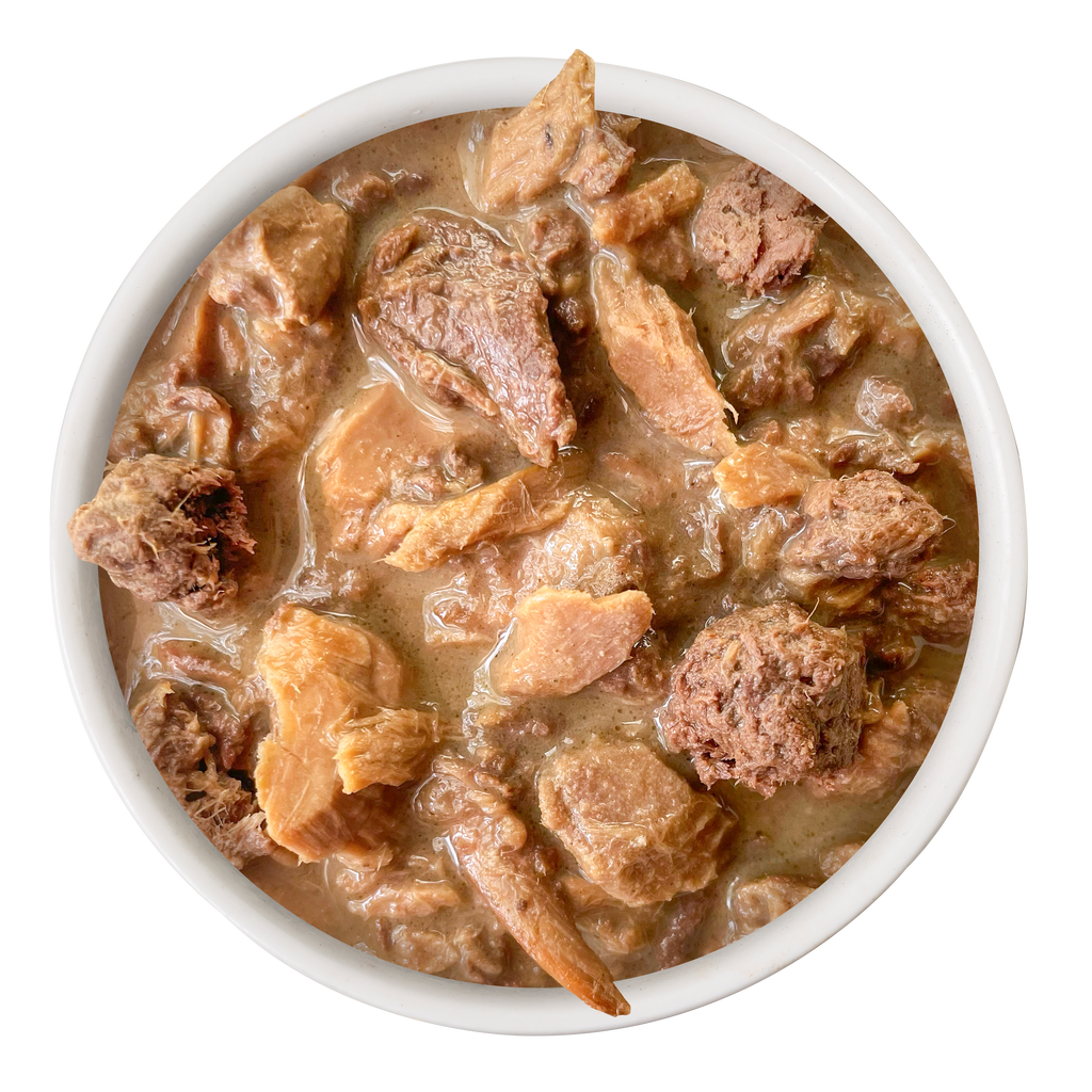 A white bowl filled with Cat Person Tuna Shreds in Broth, seen from above on a plain white background—the perfect protein-rich meal for balanced feline nutrition.
