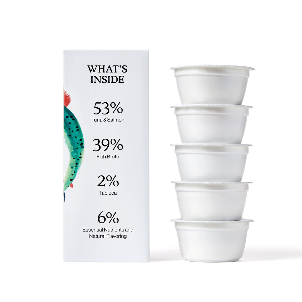 Cat Person’s Tuna & Salmon Shreds in Broth shows an ingredient breakdown—53% tuna and salmon, 39% fish broth, 2% tapioca, and 6% essential nutrients—beside four white plastic cups with lids, offering balanced, protein-rich nutrition for cats.