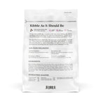 Back of a white Cat Person Duck & Turkey Dry Food bag labeled "Kibble As It Should Be," showcasing high protein, no fillers, and all-natural benefits. Text includes nutrition info, healthy ingredients list, and a guaranteed analysis chart.