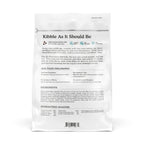 A white bag of Cat Person Salmon & Tuna Dry Food features "Kibble As It Should Be," highlighting high protein, grain-free, no fillers, and natural ingredients. Ingredients, feeding guidelines, and nutrition info appear on the back.