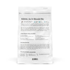 A white bag of Cat Person's Salmon & Tuna Dry Food labeled "Kibble As It Should Be," featuring clean, all-natural, high-protein, grain-free cat food with ingredient details, nutritional philosophy, and guaranteed analysis.
