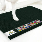 Top view of Muddy Mat anti-mud dog door mat in hunter green showcasing dense chenille tufts and non slip backing with white floor background