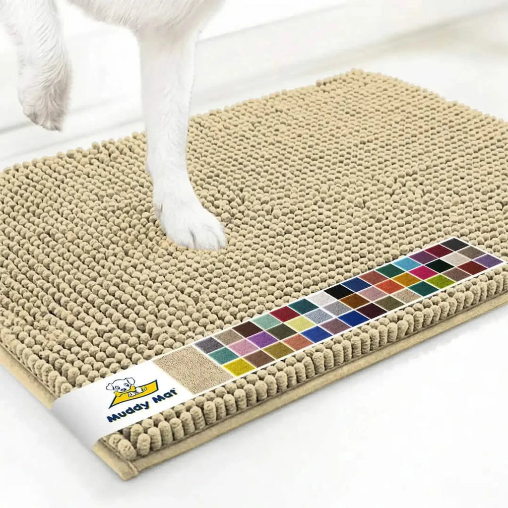 Angled view of Muddy Mat anti-mud dog door mat in sand showcasing chenille nub texture and non-slip backing on white floor