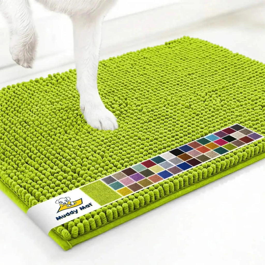 Close-up of Muddy Mat® anti-mud dog door mat in spring green showing chenille nubs and a dog’s paw on a white floor