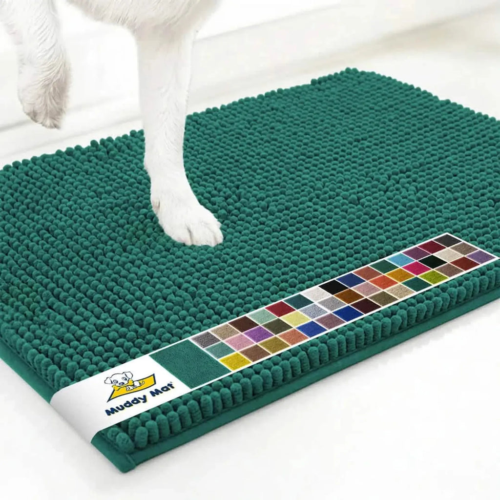 Top-down view of Muddy Mat Anti-Mud Dog Door Mat in slate blue showcasing textured chenille surface with a dog paw on a white floor
