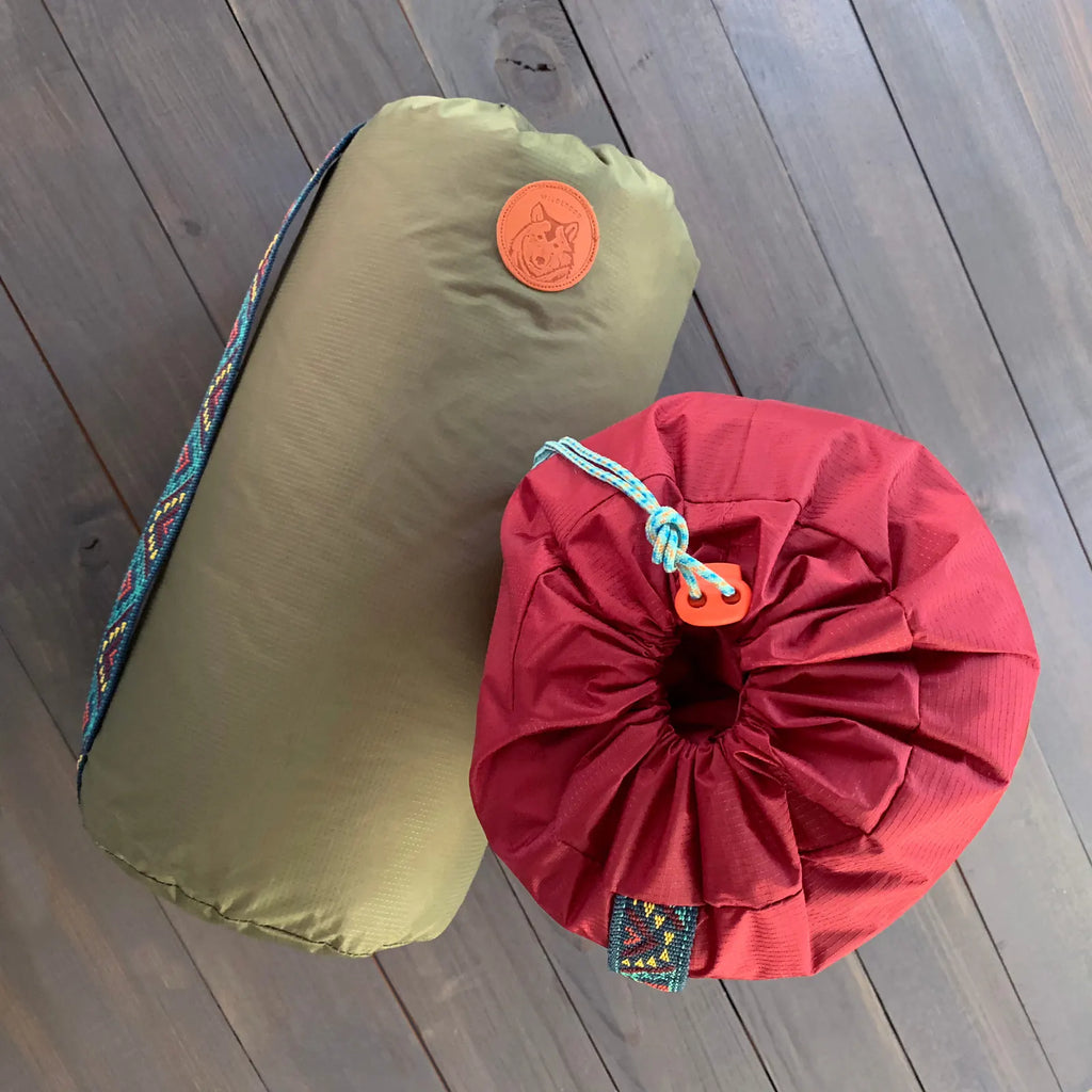 Water resistant dog camping sleeping bag with stuff sack