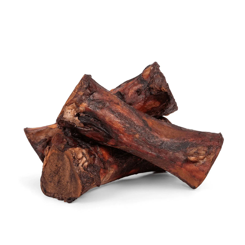 Three smoked beef marrow bones stacked together
