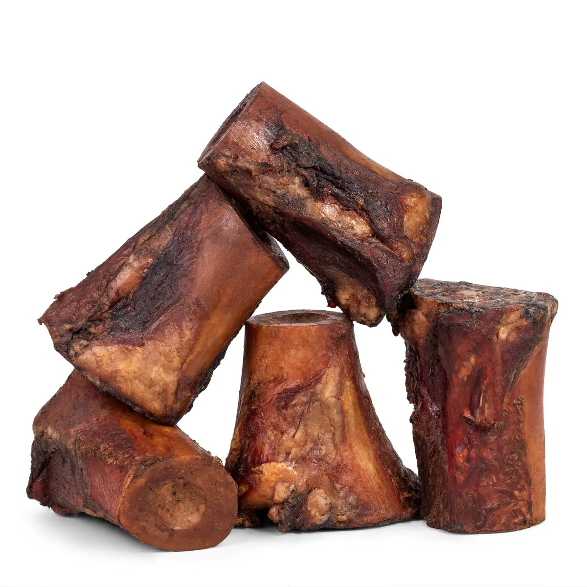 Angled view of three smoked beef marrow bones stacked showcasing exposed marrow and smoked exterior on white background